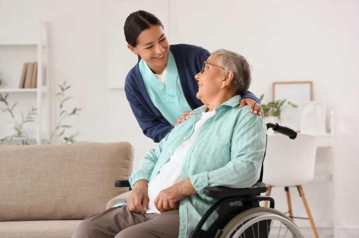 Happy caregiver with senior woman